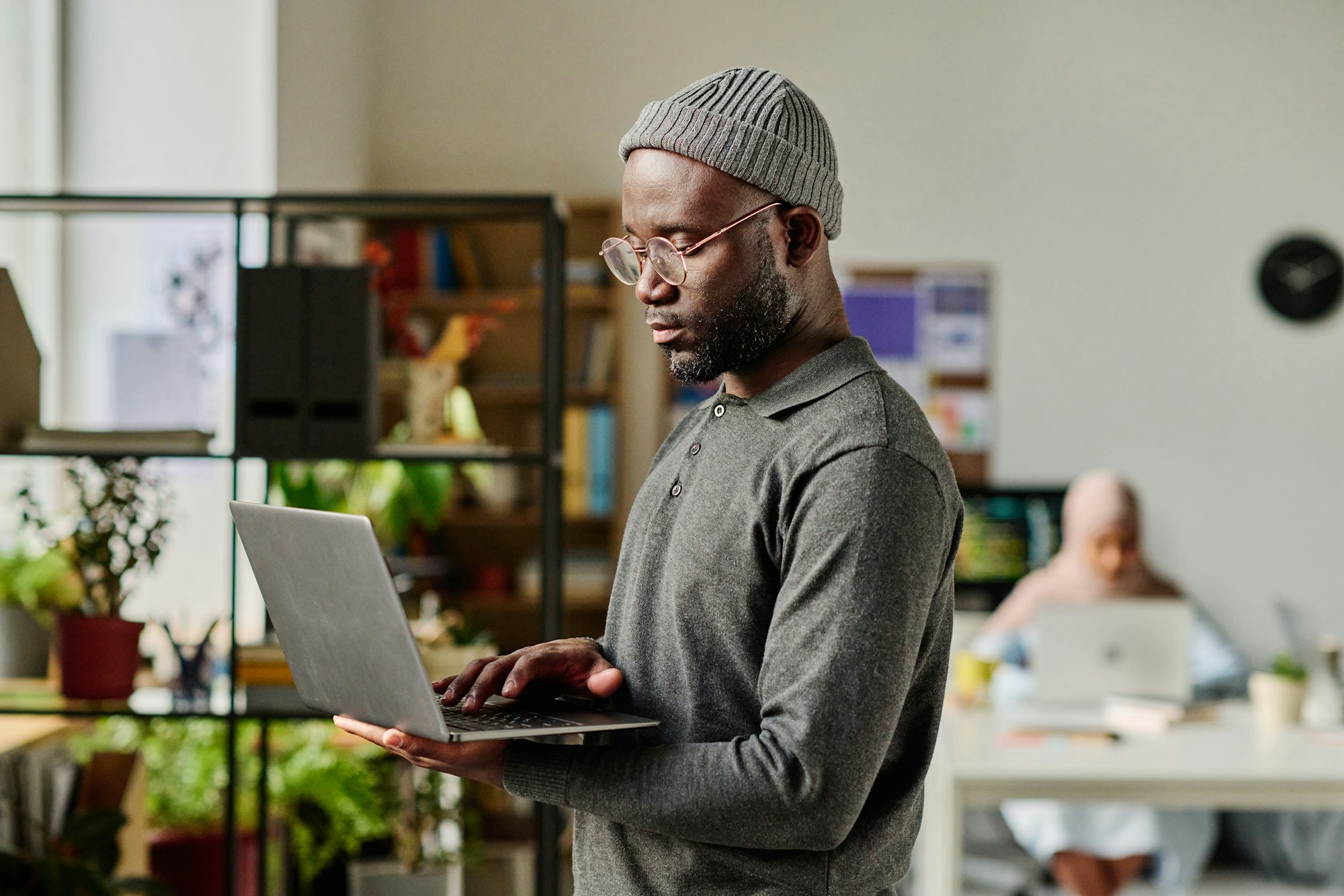 Developer using laptop in IT office